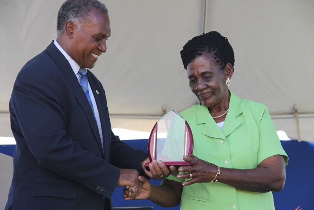 Premier of Nevis Hon. Vance Amory presents a plaque to the Department of Agriculture’s 22nd Annual Open Day Patron Dulcina Brookes-Byron at the opening ceremony at the Villa Grounds on March 17, 2016